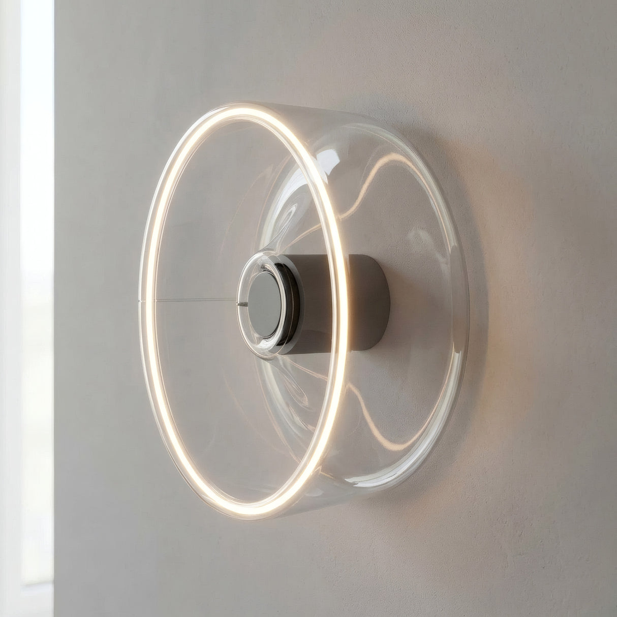 Lâmpada LED donut E27 em vidro transparente, Ø 195 mm, como aplique de parede com um halo de luz quente