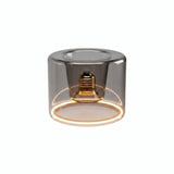 Lâmpada LED donut E27 em vidro fumado, Ø 120 mm, acesa, anel de luz quente, fundo branco