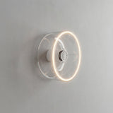 Lâmpada LED donut E27 em vidro transparente, Ø 195 mm, acesa como aplique de parede num interior sóbrio