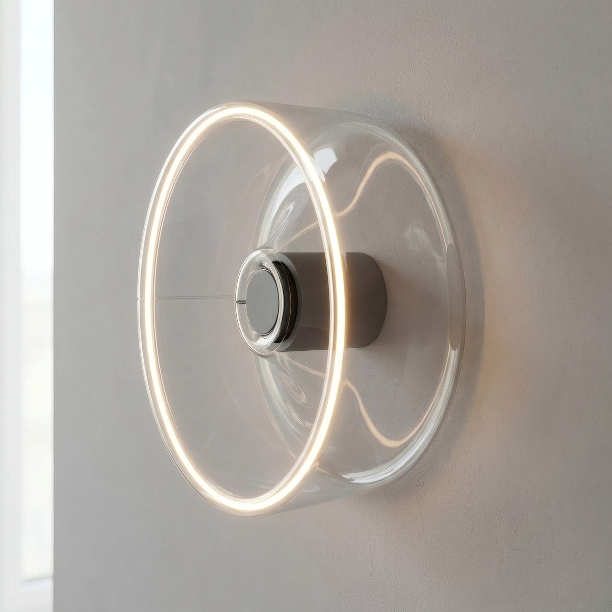 Lâmpada LED donut E27 em vidro transparente, Ø 195 mm, como aplique de parede com um halo de luz quente