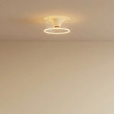 Lâmpada LED donut E27 em vidro transparente, Ø 195 mm, acesa no teto de um interior sóbrio